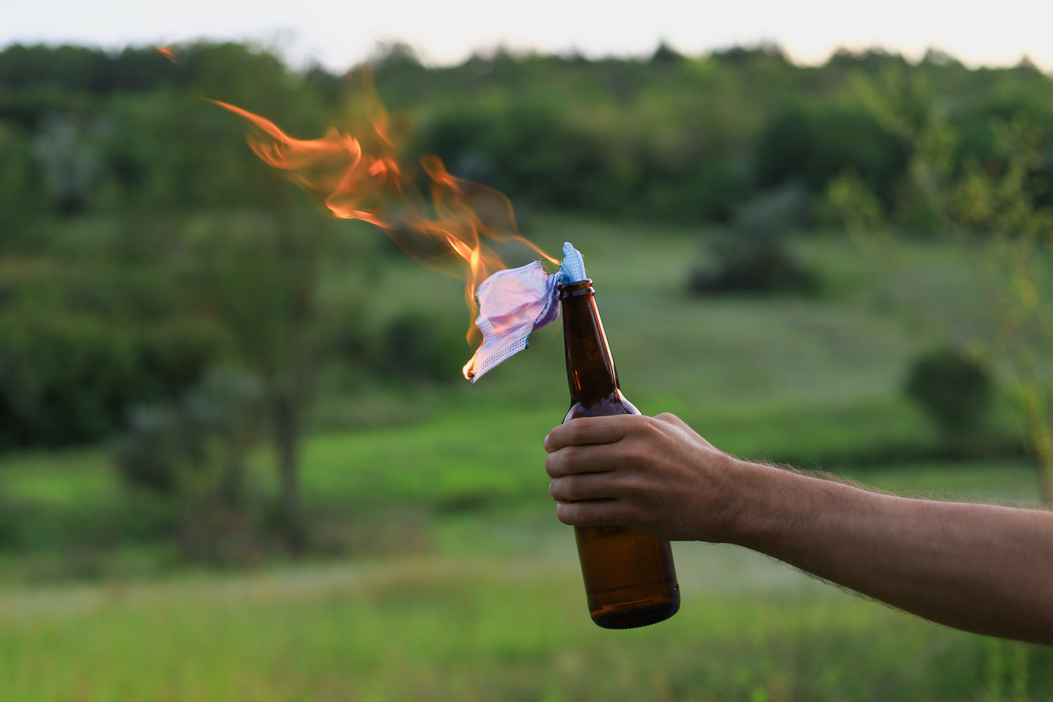 molotov-cocktail-with-face-mask-fuse-in-field-2026-09-22-10-23-59-utc-2